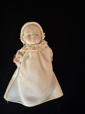 Antique-Style Porcelain Baby Doll in Cream Dress